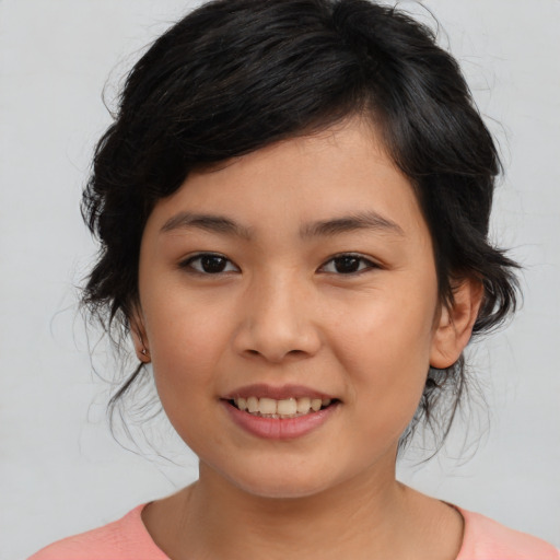 Joyful asian young-adult female with medium  black hair and brown eyes