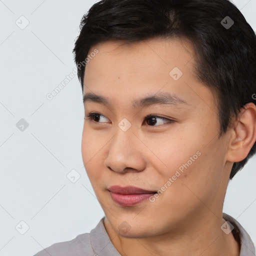 Joyful asian young-adult male with short  brown hair and brown eyes