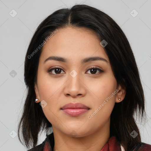 Joyful latino young-adult female with medium  brown hair and brown eyes