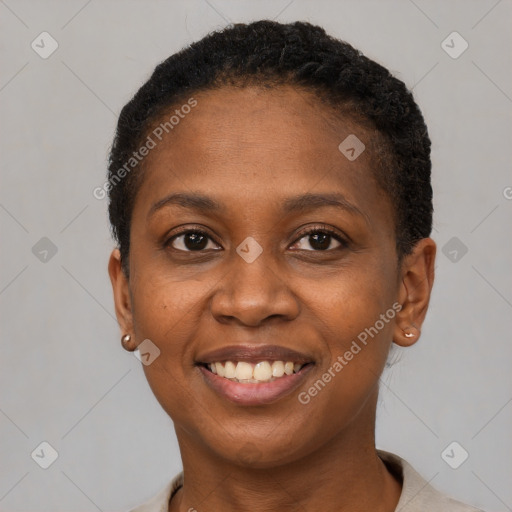 Joyful black young-adult female with short  brown hair and brown eyes