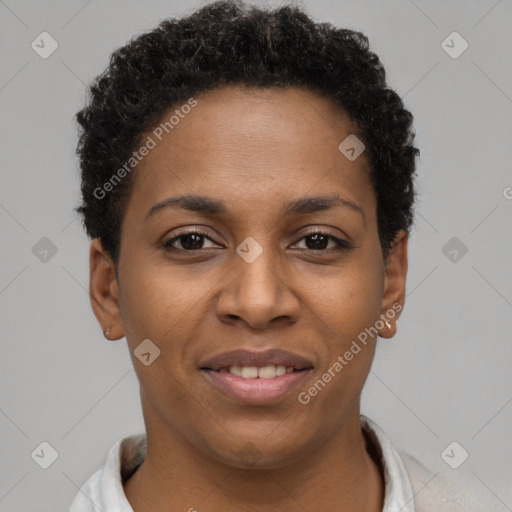 Joyful black young-adult female with short  brown hair and brown eyes