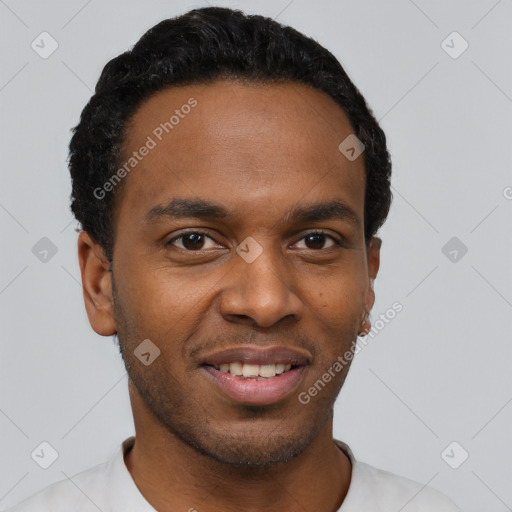 Joyful black young-adult male with short  black hair and brown eyes