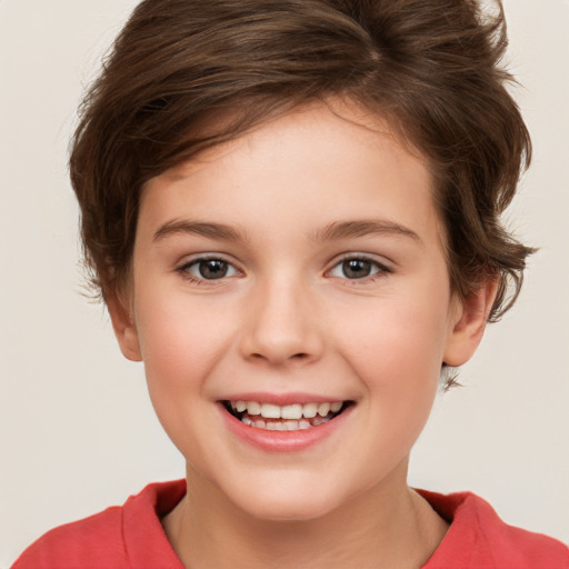 Joyful white child female with short  brown hair and brown eyes