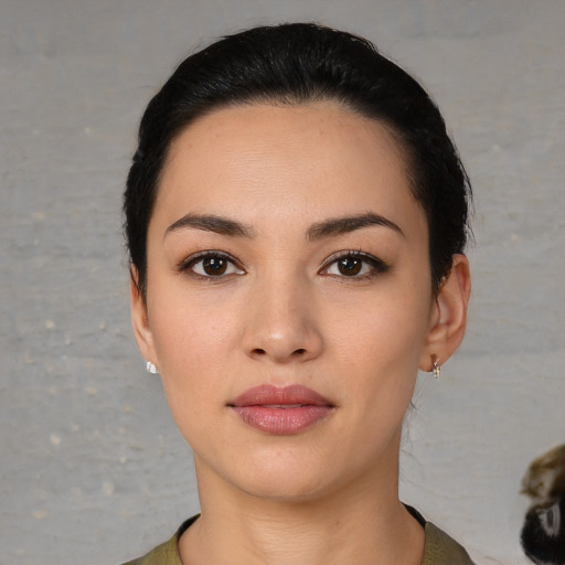 Neutral white young-adult female with short  black hair and brown eyes