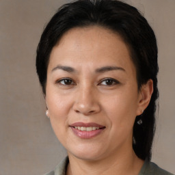 Joyful white adult female with medium  brown hair and brown eyes