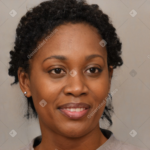 Joyful black adult female with short  brown hair and brown eyes