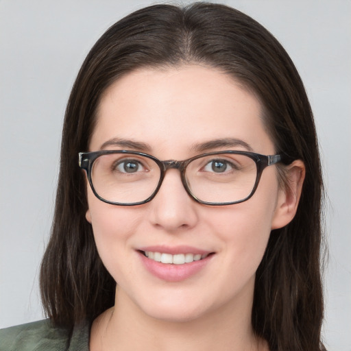 Joyful white young-adult female with medium  brown hair and blue eyes