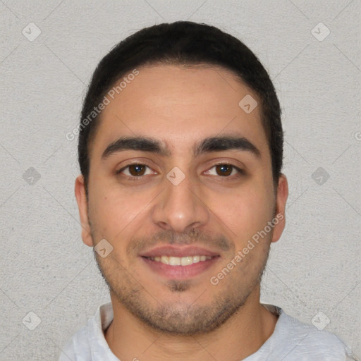 Joyful white young-adult male with short  black hair and brown eyes