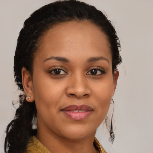 Joyful black young-adult female with medium  brown hair and brown eyes