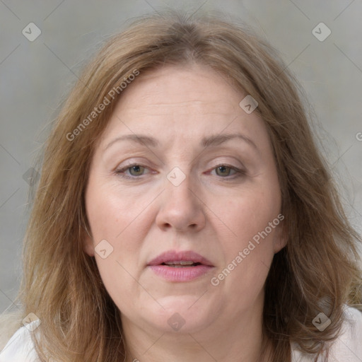 Joyful white adult female with medium  brown hair and grey eyes