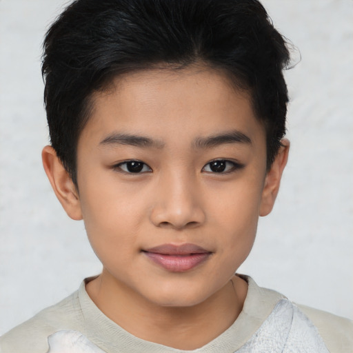 Joyful asian child female with short  brown hair and brown eyes