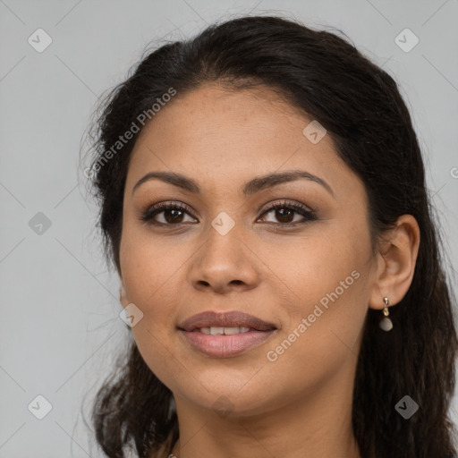 Joyful latino young-adult female with long  brown hair and brown eyes