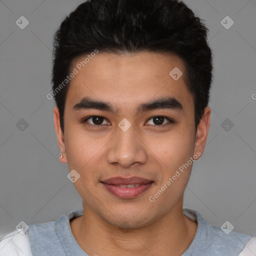 Joyful latino young-adult male with short  black hair and brown eyes