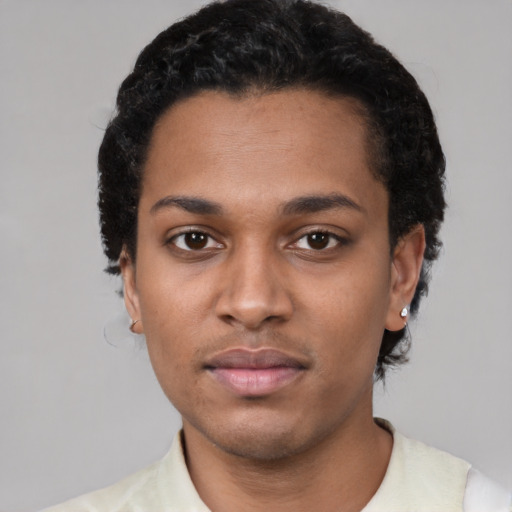 Neutral black young-adult male with short  black hair and brown eyes