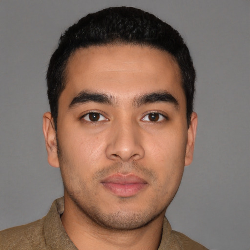 Neutral latino young-adult male with short  brown hair and brown eyes