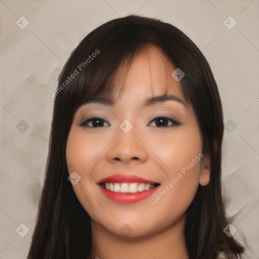 Joyful asian young-adult female with long  black hair and brown eyes