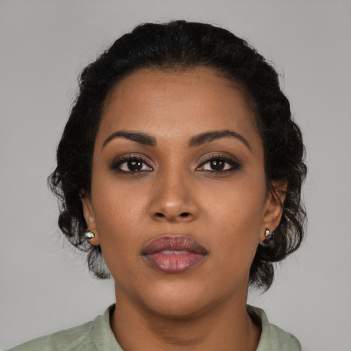 Neutral latino young-adult female with medium  brown hair and brown eyes