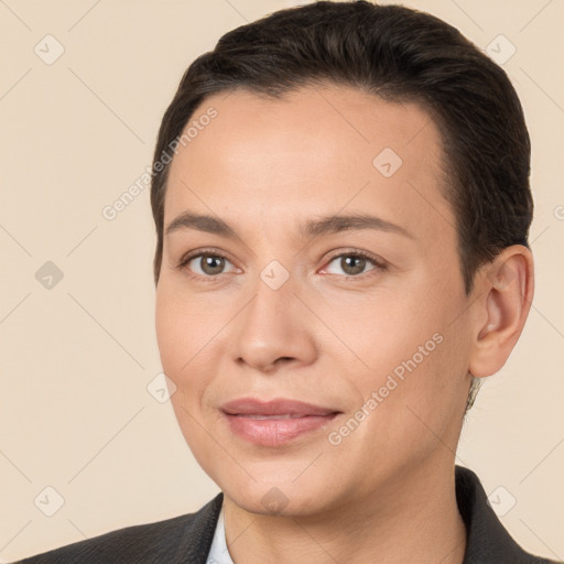 Joyful white young-adult female with short  brown hair and brown eyes