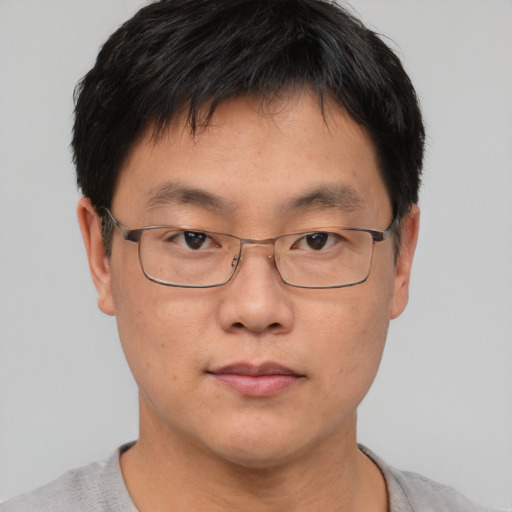 Neutral asian adult male with short  brown hair and brown eyes