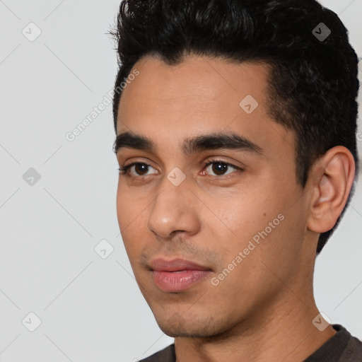 Neutral latino young-adult male with short  black hair and brown eyes