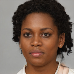 Neutral black young-adult female with short  brown hair and brown eyes