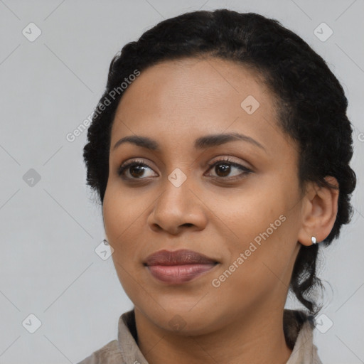 Joyful black young-adult female with medium  black hair and brown eyes