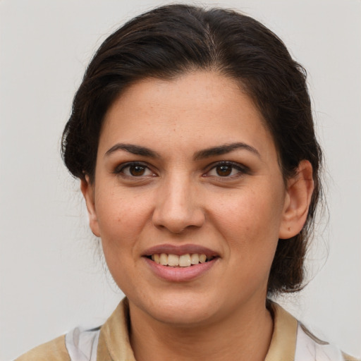 Joyful white young-adult female with medium  brown hair and brown eyes