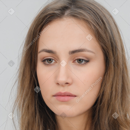 Neutral white young-adult female with long  brown hair and brown eyes