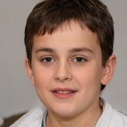 Joyful white child male with short  brown hair and brown eyes