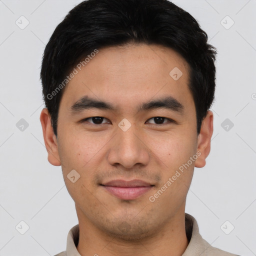 Joyful asian young-adult male with short  black hair and brown eyes