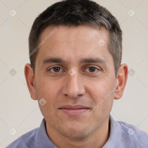 Joyful white adult male with short  brown hair and brown eyes