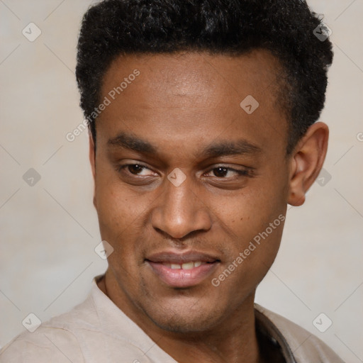 Joyful latino young-adult male with short  black hair and brown eyes