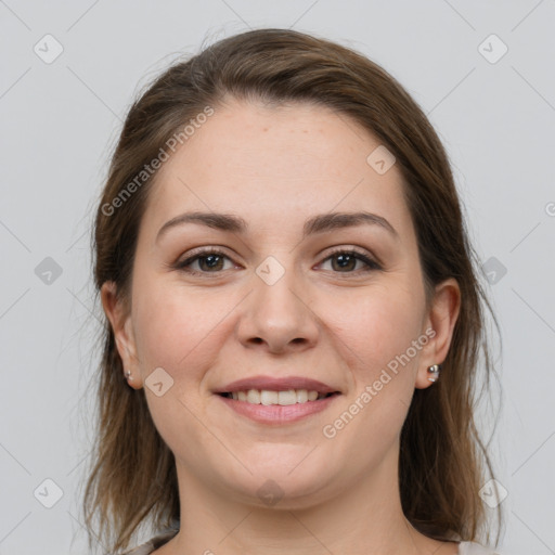 Joyful white young-adult female with medium  brown hair and grey eyes