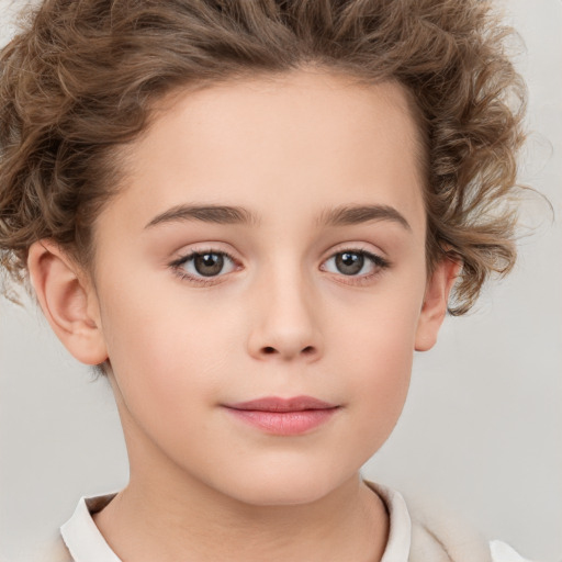 Joyful white child female with short  brown hair and brown eyes