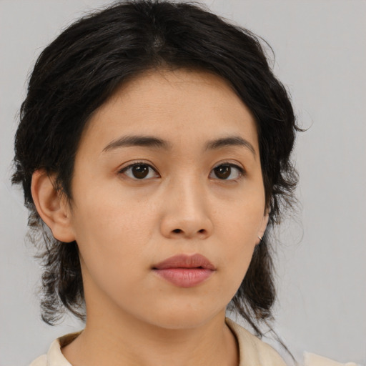 Neutral asian young-adult female with medium  brown hair and brown eyes