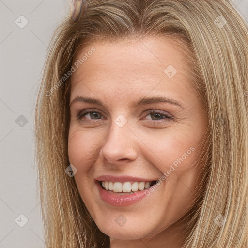 Joyful white young-adult female with long  brown hair and brown eyes