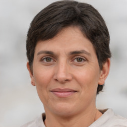 Joyful white adult female with short  brown hair and brown eyes