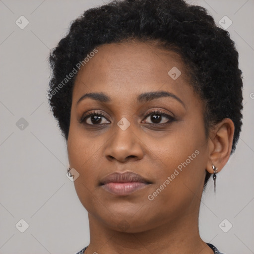 Joyful black young-adult female with short  black hair and brown eyes