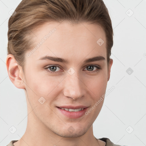 Joyful white young-adult female with short  brown hair and grey eyes