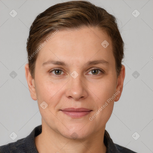 Joyful white adult female with short  brown hair and grey eyes