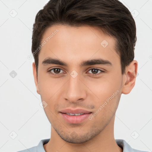 Joyful white young-adult male with short  brown hair and brown eyes