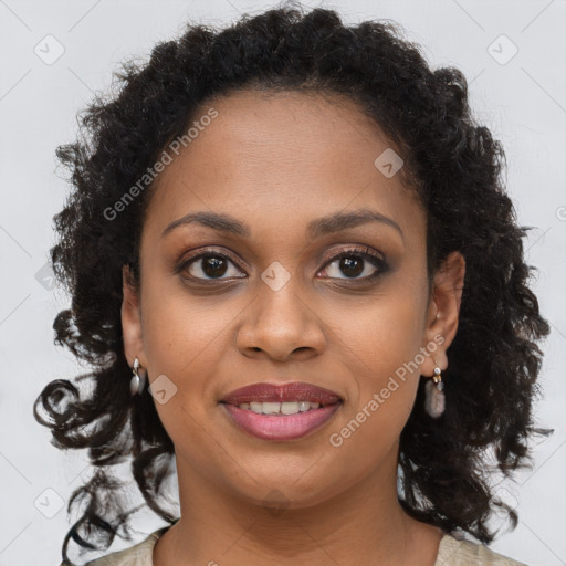 Joyful black young-adult female with long  brown hair and brown eyes