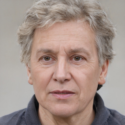 Joyful white middle-aged male with short  brown hair and grey eyes