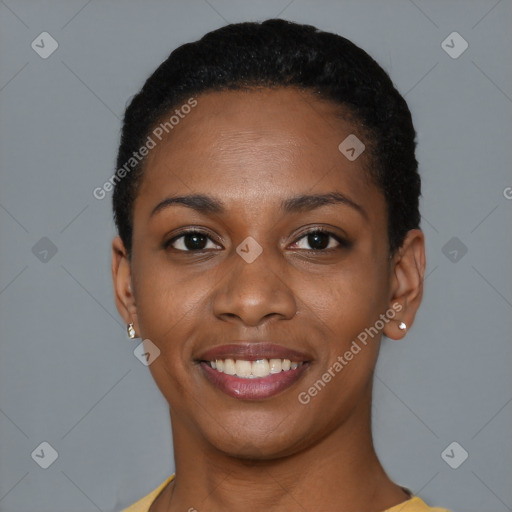 Joyful black young-adult female with short  black hair and brown eyes