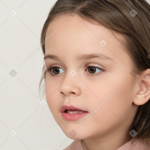 Joyful white child female with medium  brown hair and brown eyes