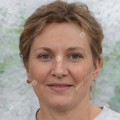 Joyful white adult female with short  brown hair and grey eyes