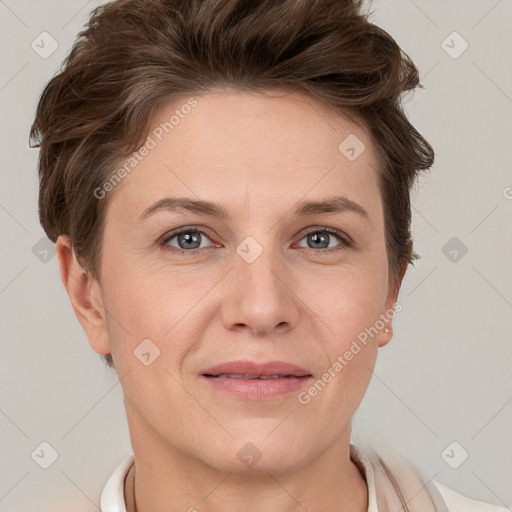 Joyful white adult female with short  brown hair and grey eyes