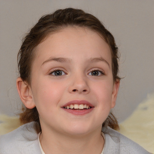 Joyful white child female with medium  brown hair and blue eyes