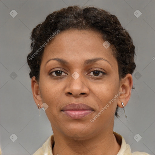 Joyful black adult female with short  brown hair and brown eyes