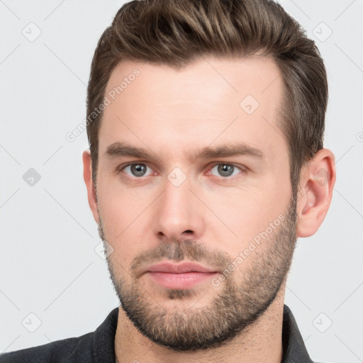 Neutral white young-adult male with short  brown hair and brown eyes